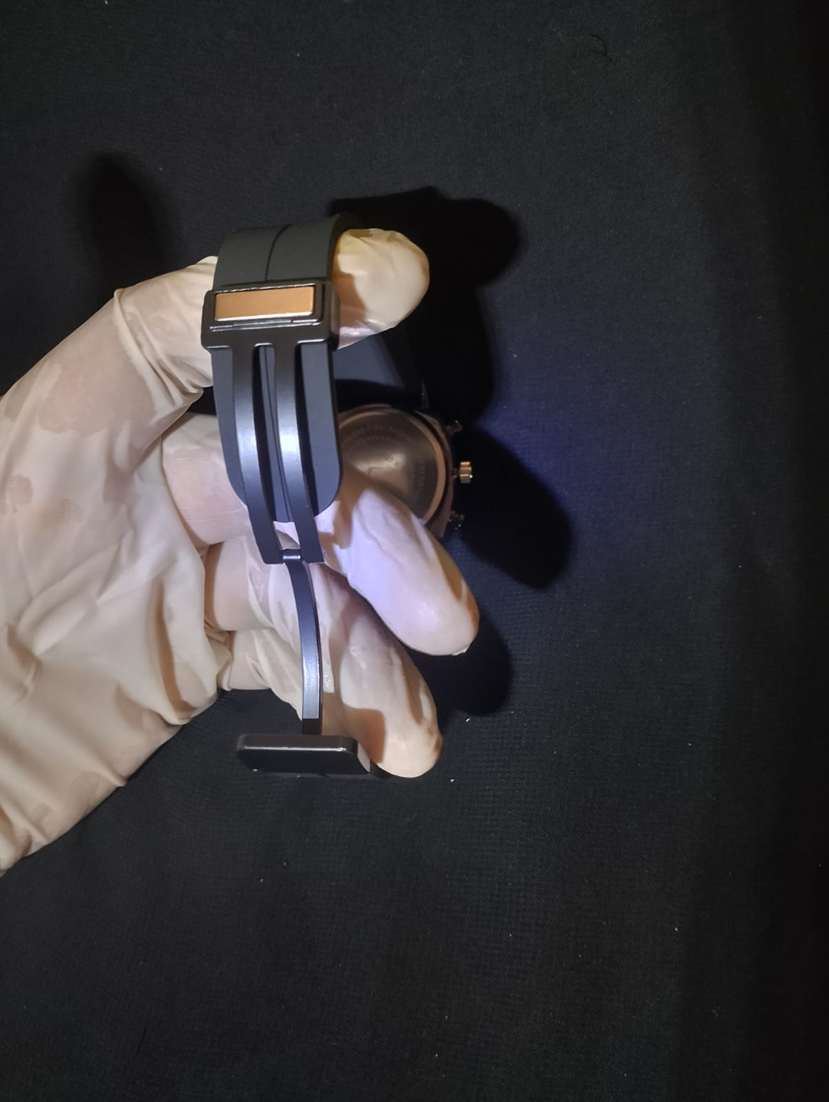 Ralex brand wrist watch with a brown silicone strap and a black -toned case.